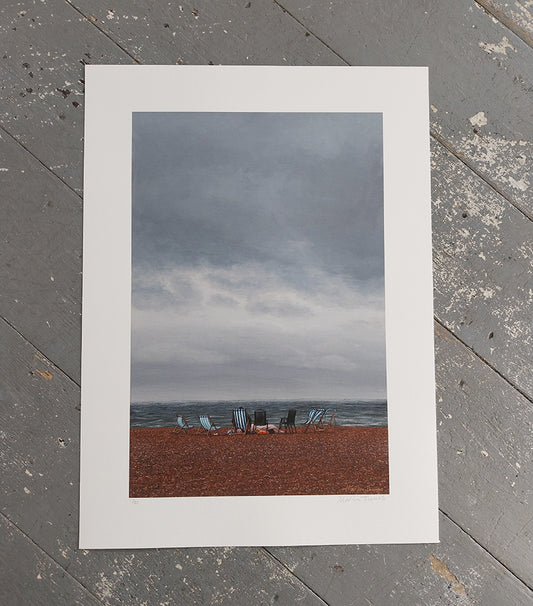 Art Print of a Brighton beach scene with deckchairs under a cloudy sky