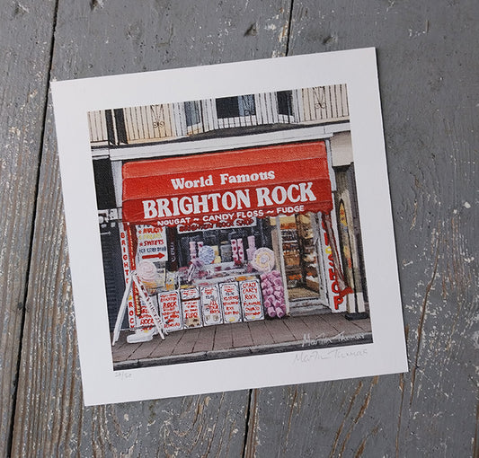 Art Print of a store front with 'World Famous Brighton Rock' sign on a wooden surface
