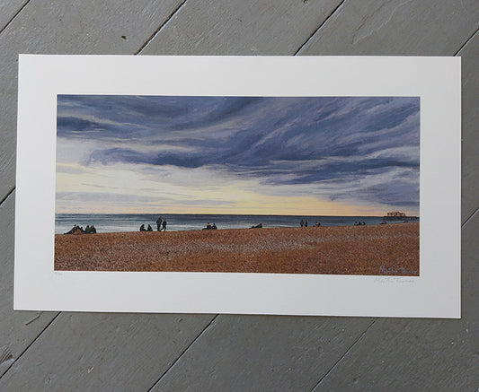 Art print of a Brighton beach scene with people and a large sky.