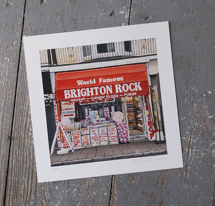 Art Print of a store front with 'World Famous Brighton Rock' sign on a wooden surface