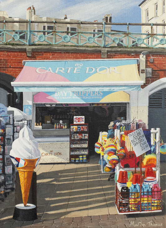 Painting by artist Martin Thomas of Daytrippers ice cream and beach shop in Brighton with colorful awning and ice cream cone display. Original artwork acrylic on canvas